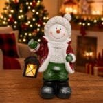 Boneco de neve em resina com lamparina iluminada, ideal para decoração natalina.