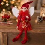 Fada decorativa natalina em tom vermelho com detalhes brilhantes, acabamento refinado e visual delicado para complementar árvores e cenários de Natal.
