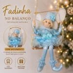 Fada Natalina Musical no Balanço na cor Azul Candy, com acabamento sofisticado, vestido detalhado e movimento delicado da cabeça.