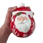 Pote natalino de cerâmica modelo Papai Noel com tampa, ideal para decorar cozinhas, armazenar açúcar, balas e biscoitos durante o Natal.