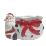 Doceira decorativa de Natal em cerâmica com Papai Noel abraçando o vaso, ideal para servir doces e decorar mesas natalinas.
