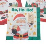 Detalhe do tema Papai Noel com diferentes ilustrações em cada lado do guardanapo, destacando a proposta de dupla estampa.
